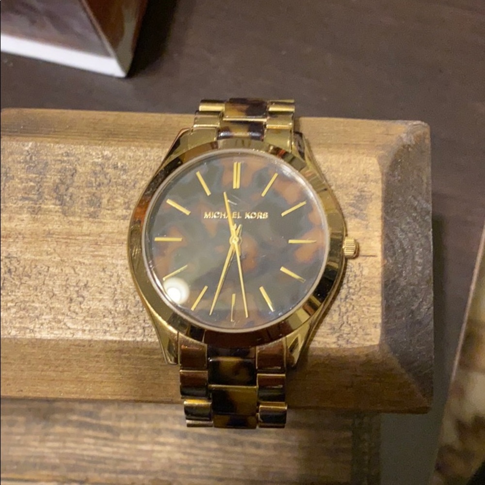 Gold and tortoise women’s Michael Kors watch